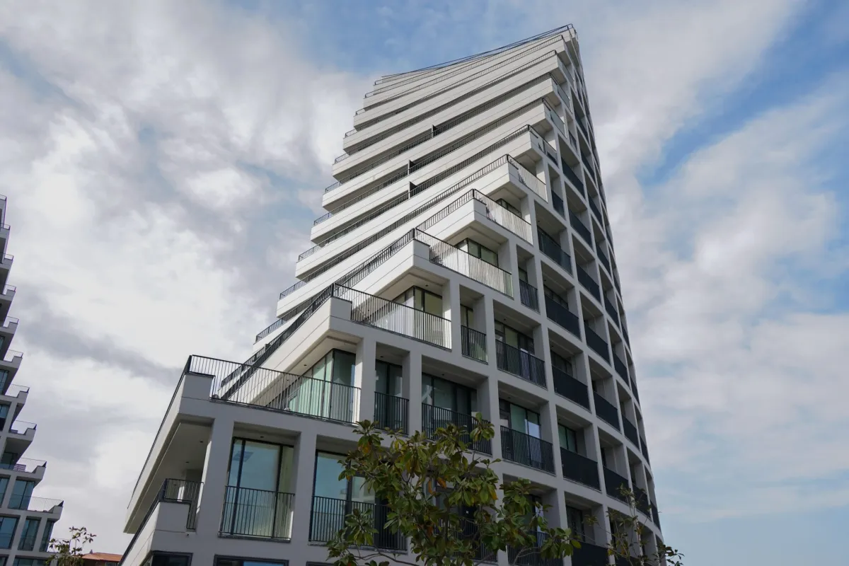 Photograph looking up at a modern, angular building